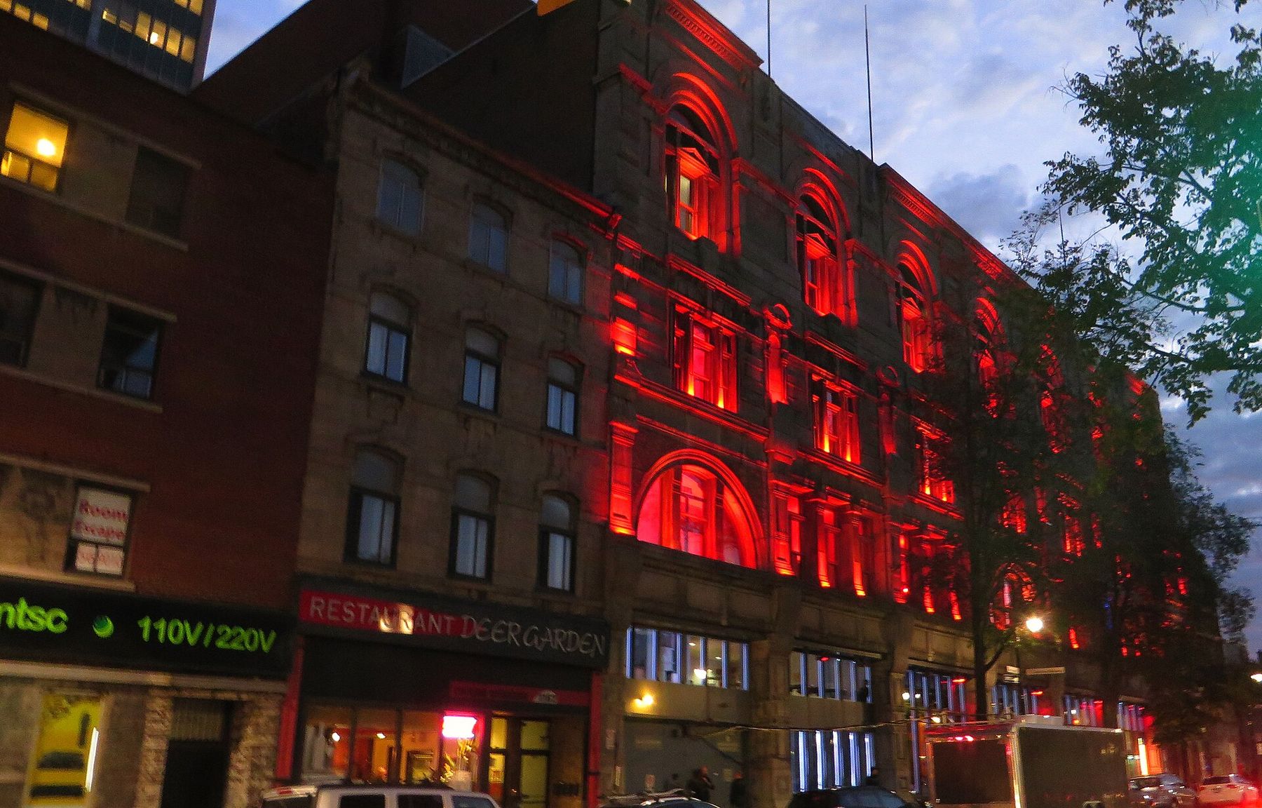 Restaurants and shops on boulevard Saint-Laurent at dusk