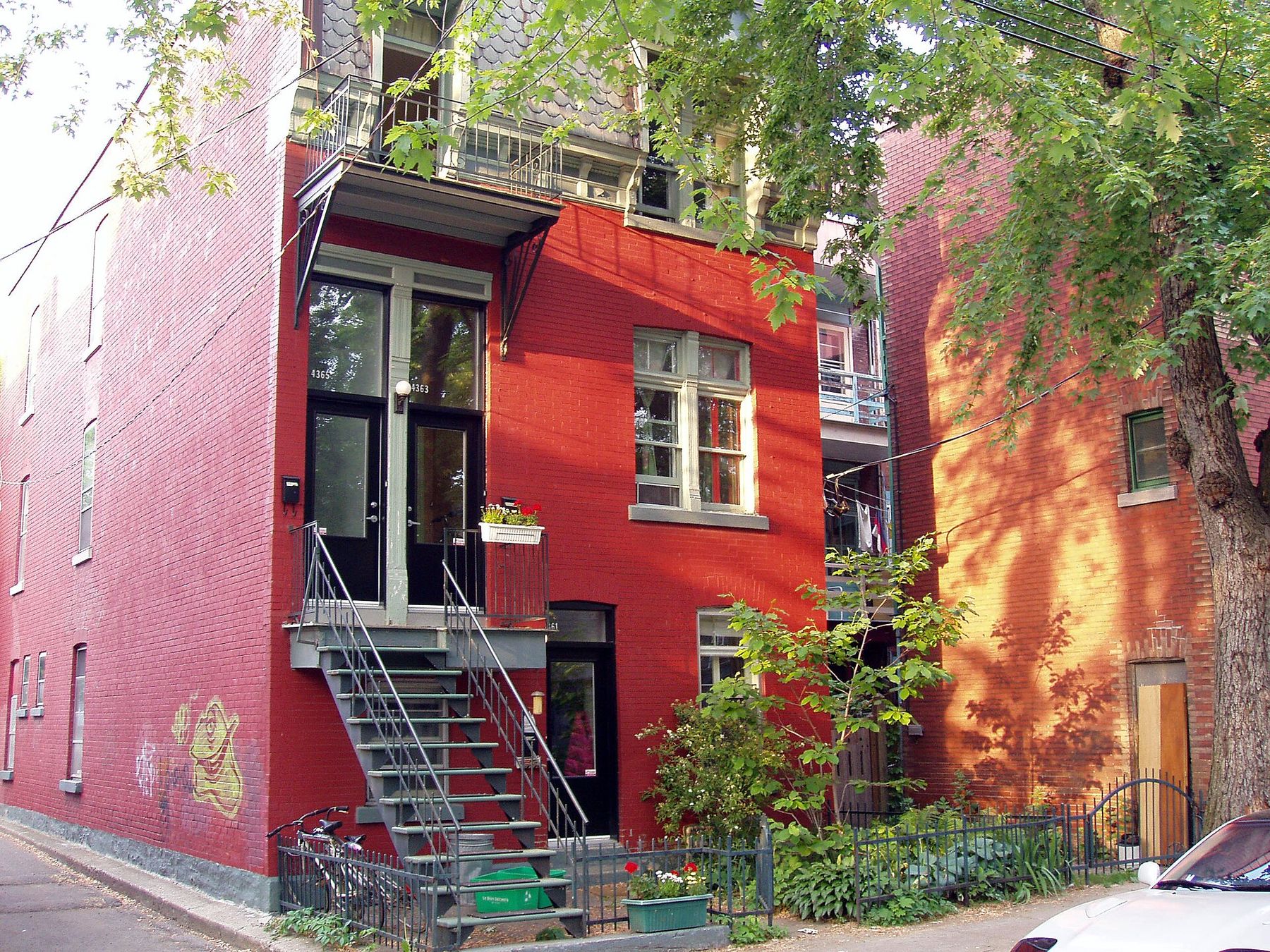 Red-brick plex with an exterior staircase on the Plateau